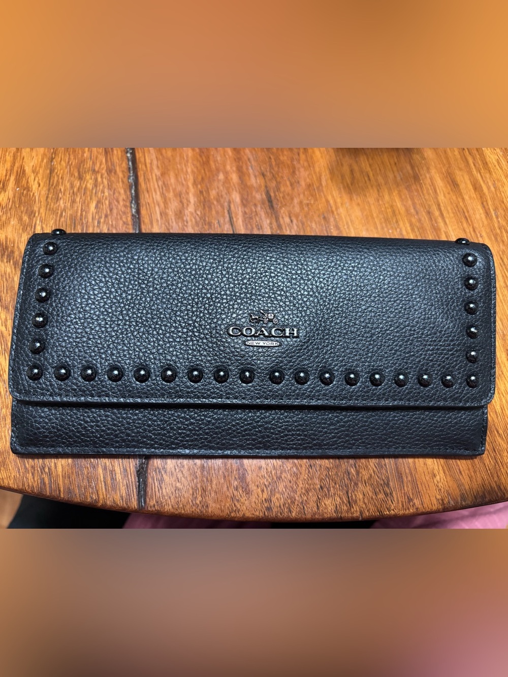 Black coach wallet with stud detailing